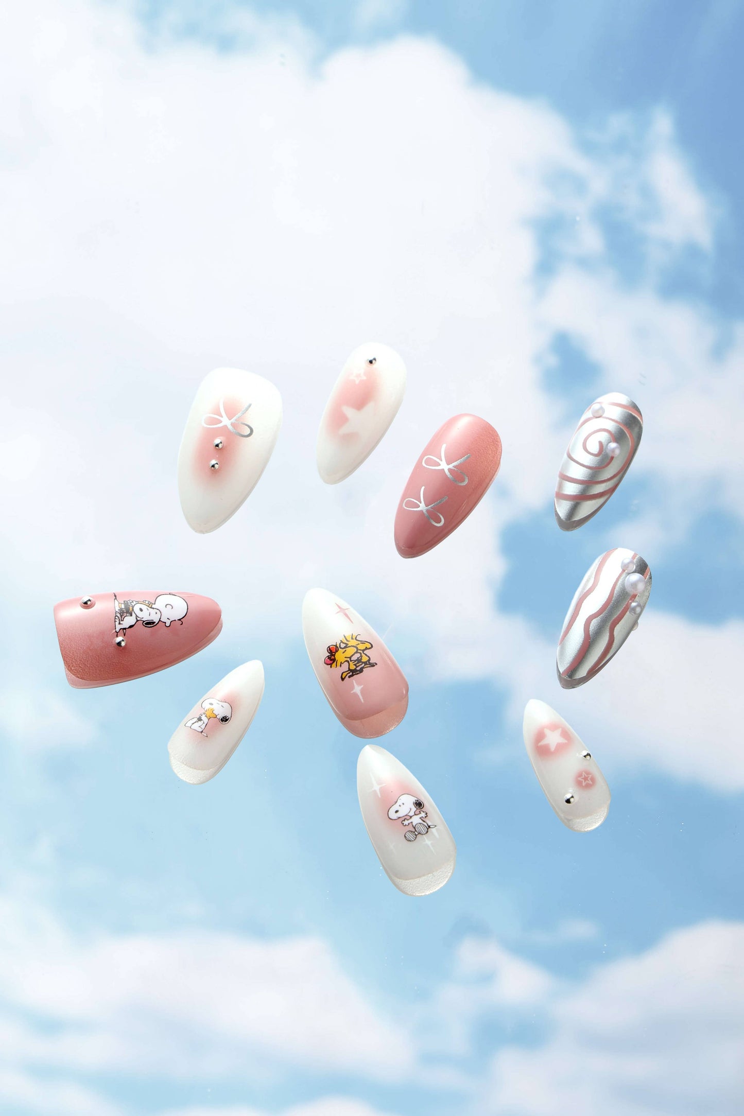 SWIRLS OF SNOOPY -  ALMOND PRESS-ON NAILS